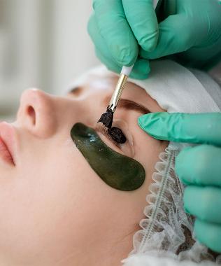 lady having an Eyelash tinting treatment at Finess Clinic