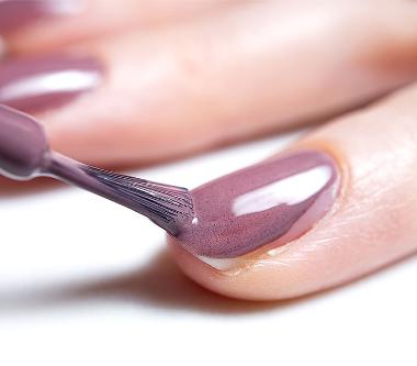 painting nails with our Shellac manicure treatment