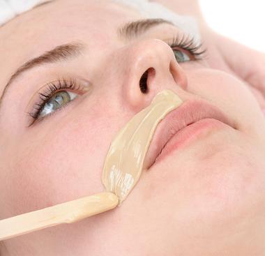 Lady having an upper lip wax as part of a waxing treatment